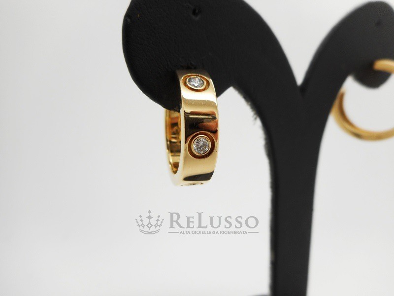 Orecchini Cartier collezione Love in oro giallo e diamanti foto5