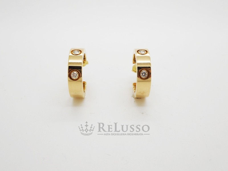 Orecchini Cartier collezione Love in oro giallo e diamanti foto10