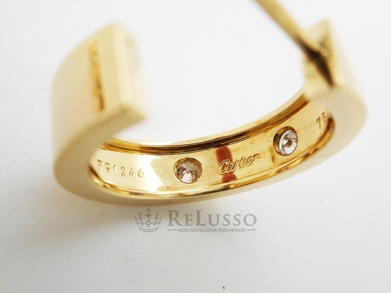 Orecchini Cartier collezione Love in oro giallo e diamanti foto12